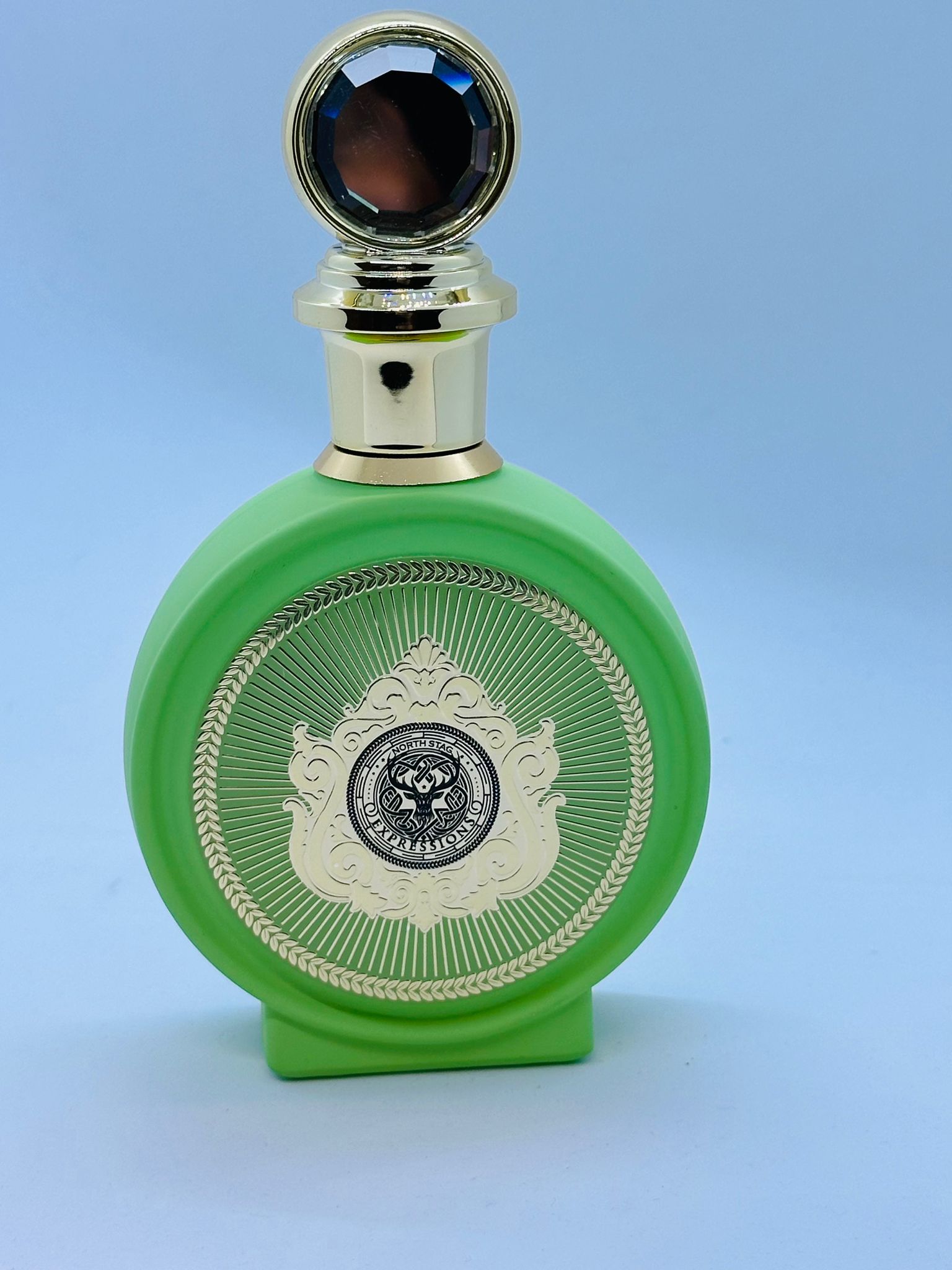 green bottle of perfume 